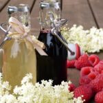 bottles, raspberries, syrup, drink, blossoms, elderberry syrup, raspberry syrup, homemade, gift, invitation, summer party, outdoors, healthy, sugar, sambucus nigra, remedies, fresh, detox